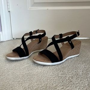 Women’s size 7.5 wedged tan and black heels.